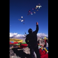 A man throwing paper Wind Horse to sky, Bumpa Ri, Lhasa