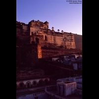 Bundi Palace at sunrise with traditional house in foreground