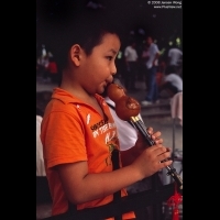 Boy playing Hulusi, Litchi Park