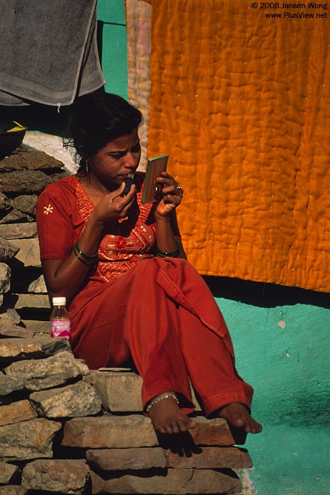 A woman making up, Bundi
