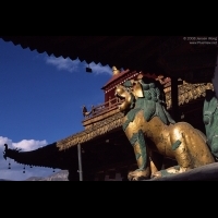 Lion statue under roof eave, Jokhang