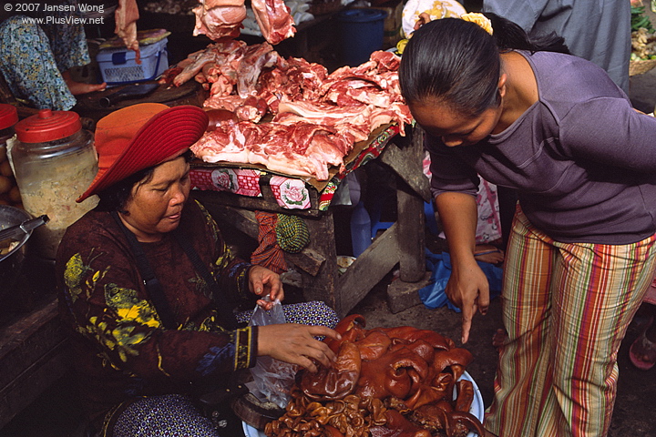 Meat vendor in local market, Siem Reap