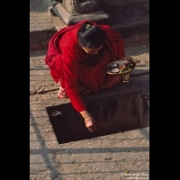 Woman offering morning Puja, Bhaktapur