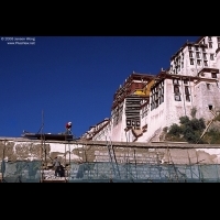 Workers maintaining the wall of Potala Palace