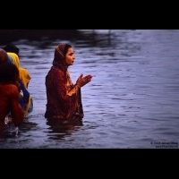 A woman praying in the Ganges, Varanasi