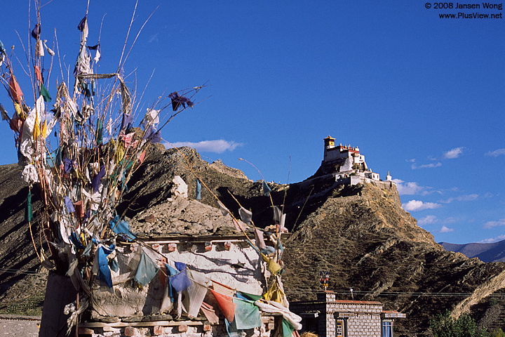 Praya flags on the rooftop of Tibetan house with Yumbulagang in background