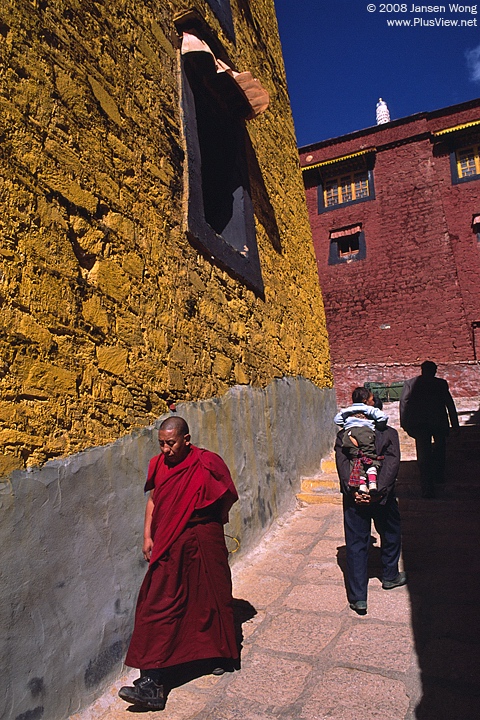 Pilgrims & monk in Ganden Monastery